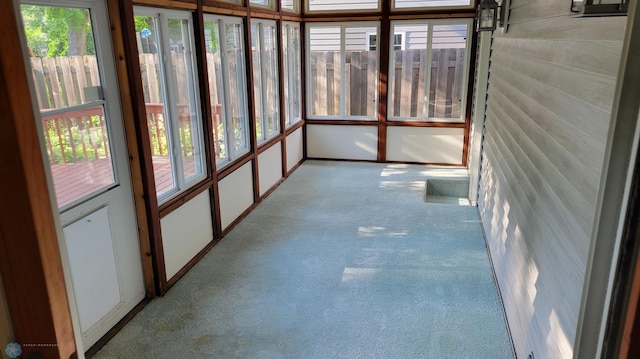 unfurnished sunroom featuring a healthy amount of sunlight