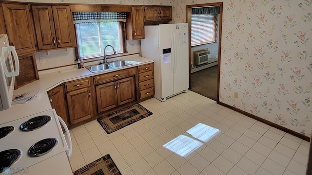 kitchen with light tile patterned flooring, sink, white refrigerator with ice dispenser, range, and a wall mounted air conditioner