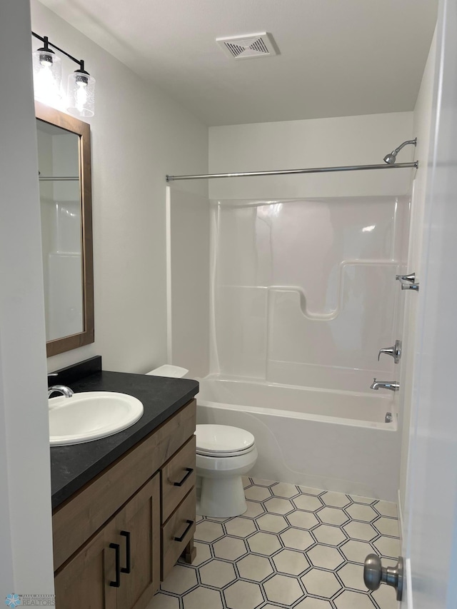 full bathroom with toilet, shower / tub combination, tile patterned floors, and vanity