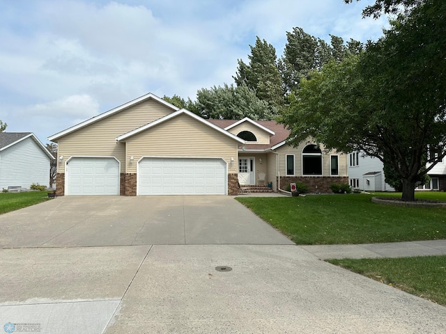 single story home with a front yard and a garage