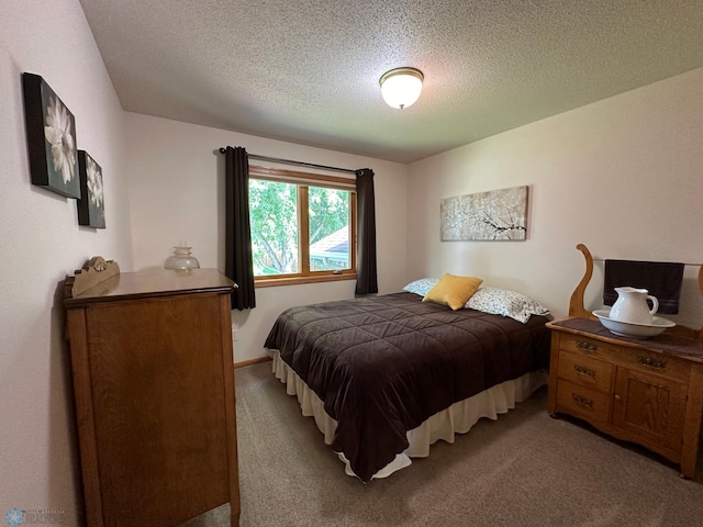 carpeted bedroom with a textured ceiling