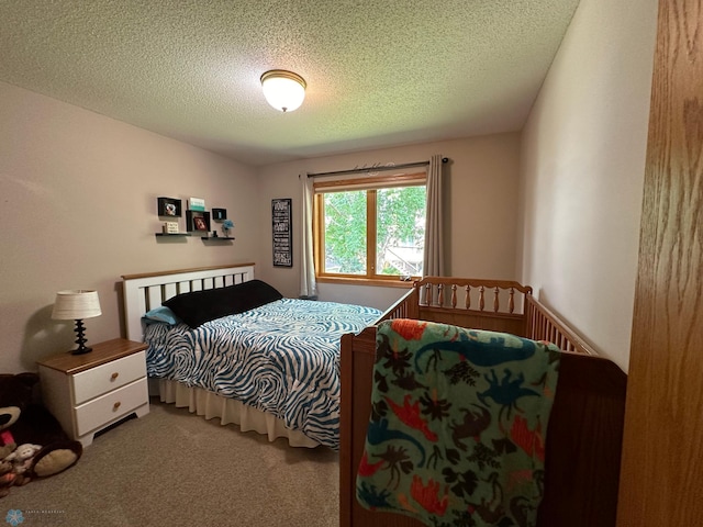 carpeted bedroom with a textured ceiling