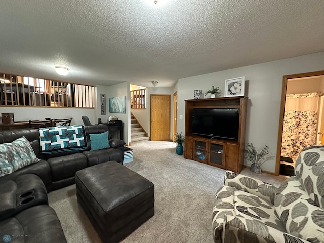 living room featuring light colored carpet and a textured ceiling