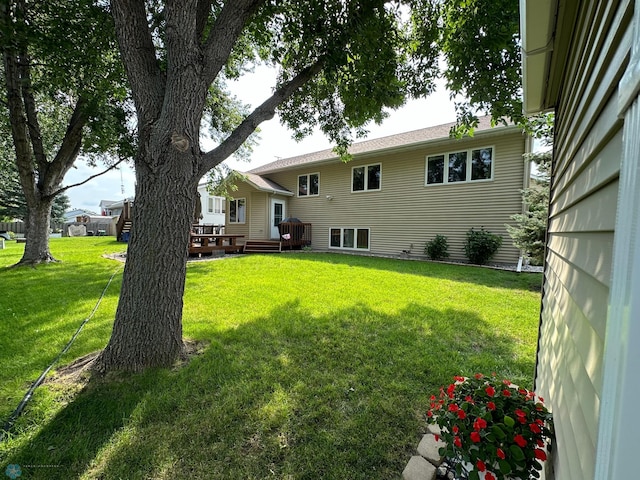 view of yard with a wooden deck