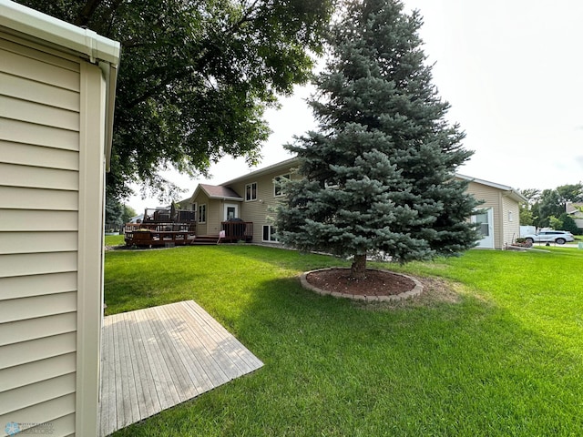 view of yard with a wooden deck