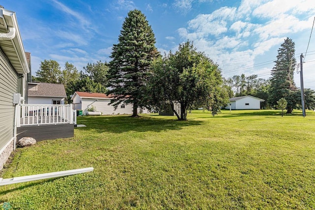 view of yard featuring a wooden deck