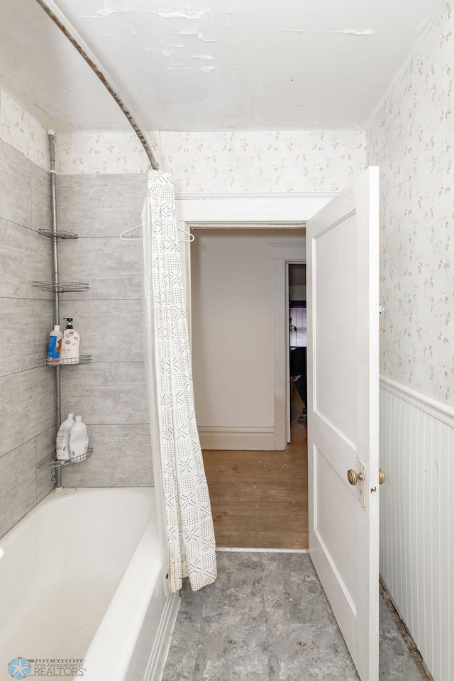 bathroom featuring shower / bath combo and wood-type flooring