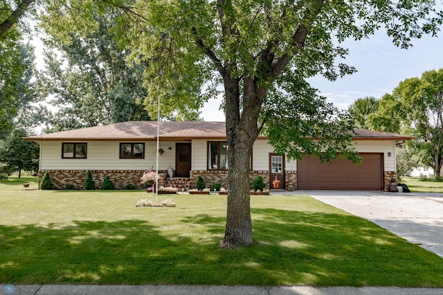 view of front of home with a front lawn and a garage