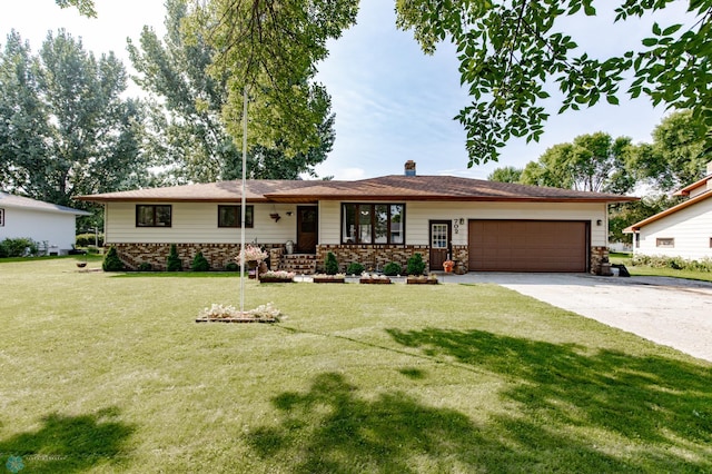 single story home featuring a garage and a front yard