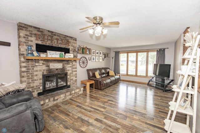 living room with a fireplace, ceiling fan, a textured ceiling, and hardwood / wood-style flooring