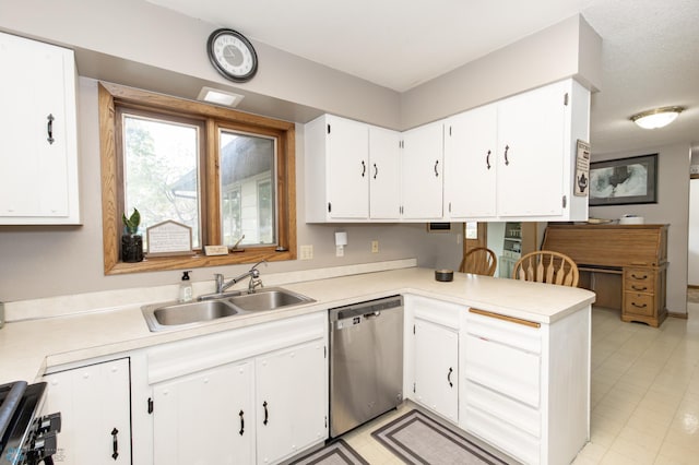 kitchen with sink, white cabinets, stainless steel dishwasher, and light tile patterned floors