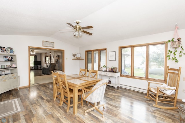 dining room with ceiling fan, dark hardwood / wood-style floors, and lofted ceiling