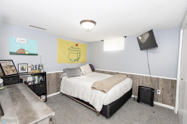 carpeted bedroom with a textured ceiling