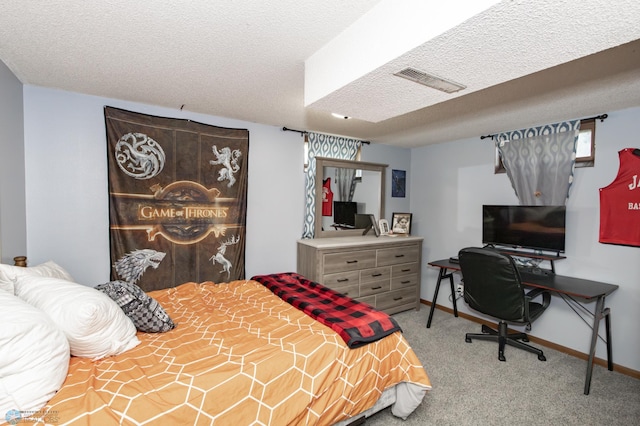 carpeted bedroom featuring a textured ceiling