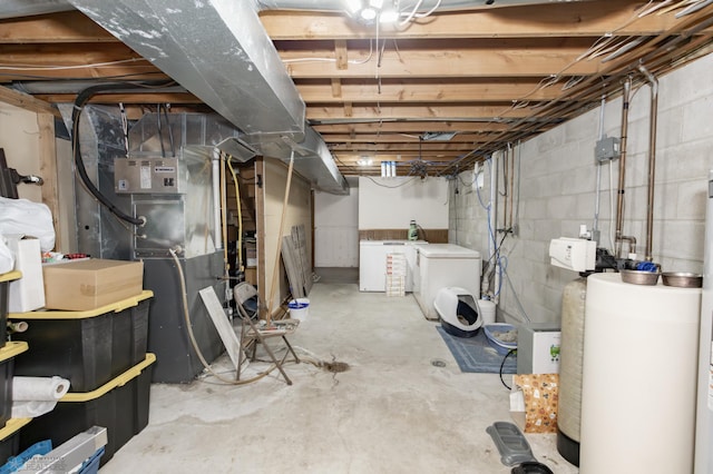 basement with heating unit and washer and dryer