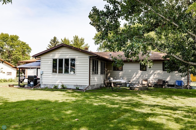 back of house with a yard