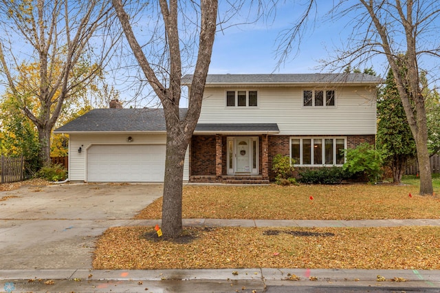 view of front property with a garage and a front lawn