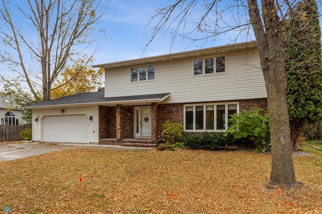 view of front property with a front yard and a garage