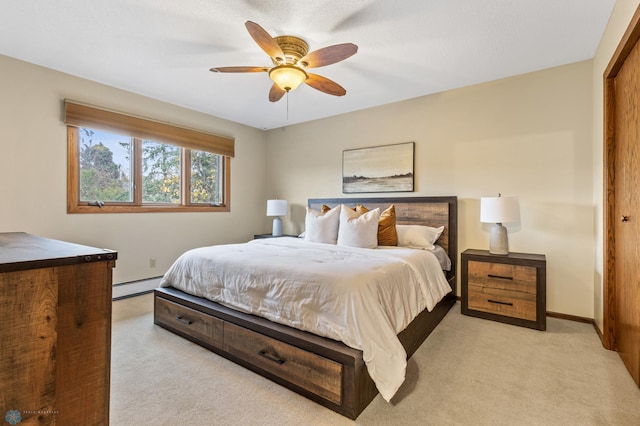 carpeted bedroom featuring baseboard heating, a closet, and ceiling fan