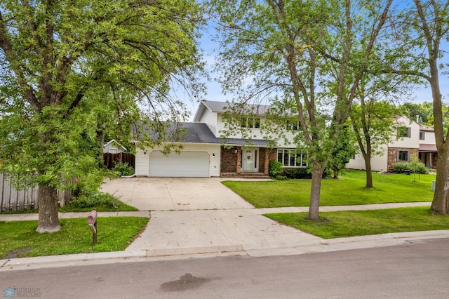 view of front facade featuring a front lawn and a garage