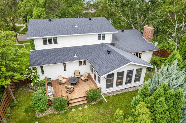 back of property with a wooden deck