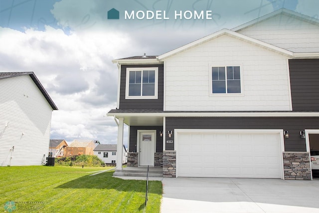 view of front facade with central AC, a front lawn, and a garage