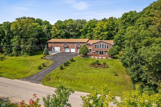 view of front of home featuring a garage and a front yard