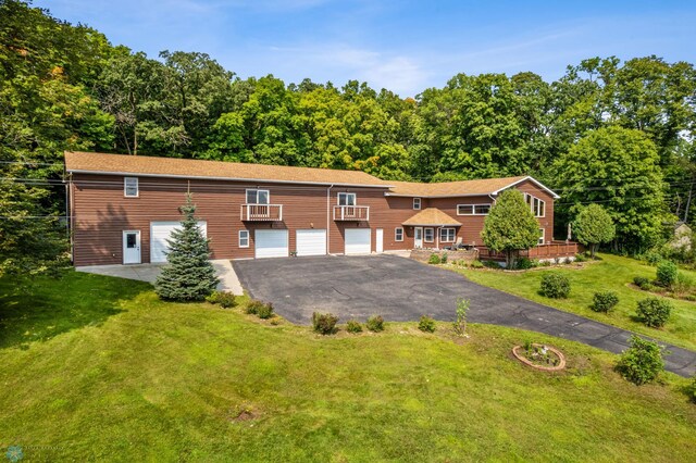 ranch-style home with a garage and a front yard