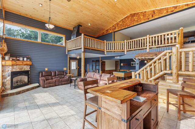 kitchen with pool table, wood ceiling, light tile patterned floors, a fireplace, and decorative light fixtures