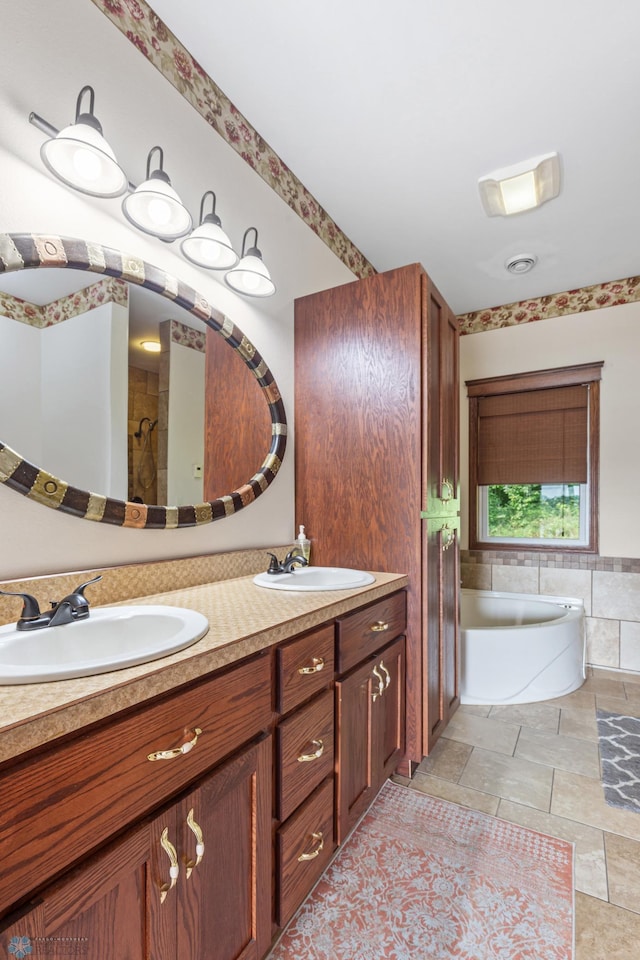 bathroom with plus walk in shower, vanity, and tile patterned floors