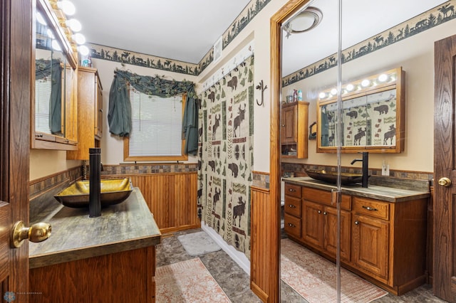 bathroom featuring tile patterned flooring and vanity