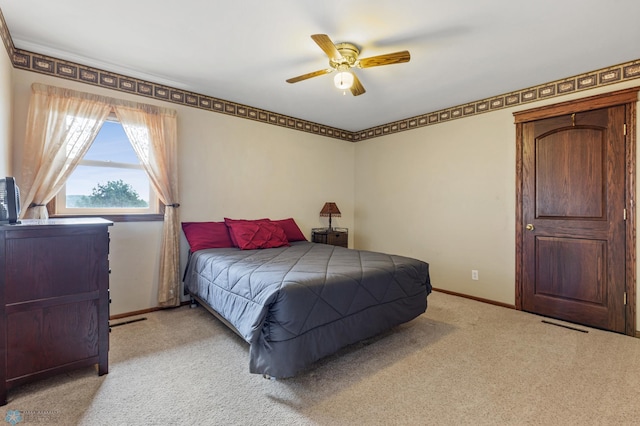 carpeted bedroom with ceiling fan