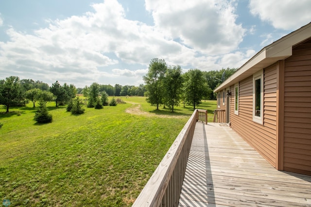 wooden deck with a lawn