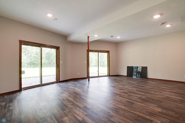 unfurnished living room featuring dark hardwood / wood-style flooring