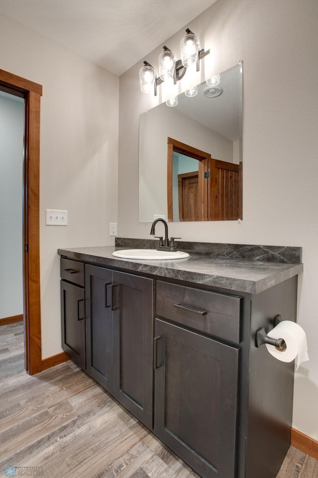 bathroom with wood-type flooring and vanity