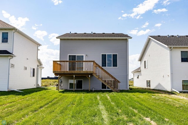 back of property featuring a lawn and a deck