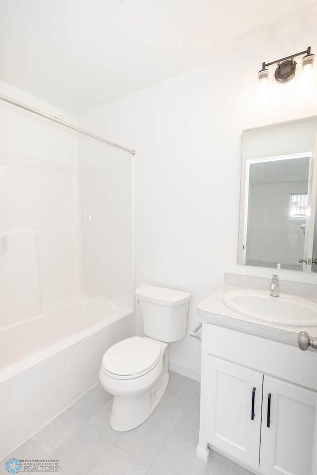 full bathroom featuring tile patterned flooring, toilet, bathing tub / shower combination, and vanity