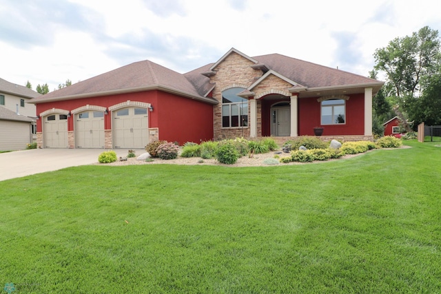 view of front of home with a front lawn and a garage