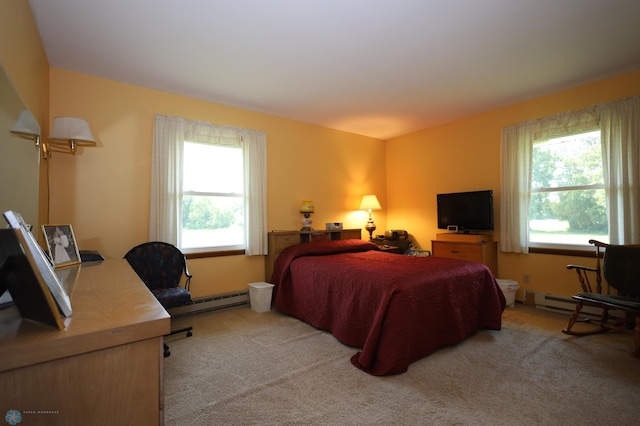 carpeted bedroom featuring a baseboard radiator and multiple windows