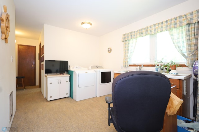 home office with light colored carpet and independent washer and dryer