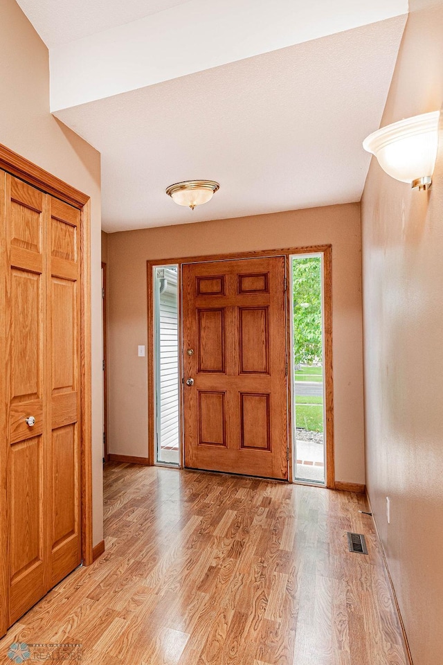 entrance foyer with light wood-type flooring