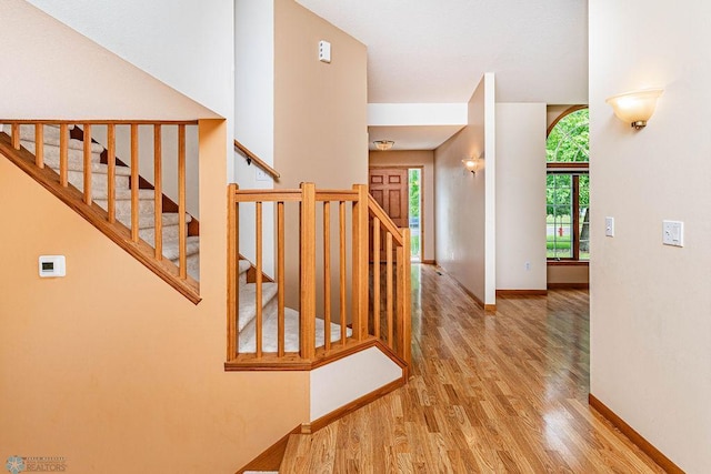 stairway featuring hardwood / wood-style floors