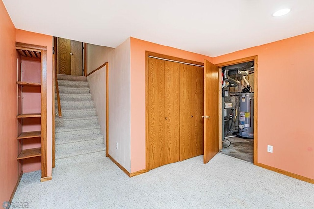 bedroom featuring gas water heater and a closet