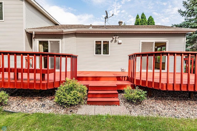 rear view of house with a deck