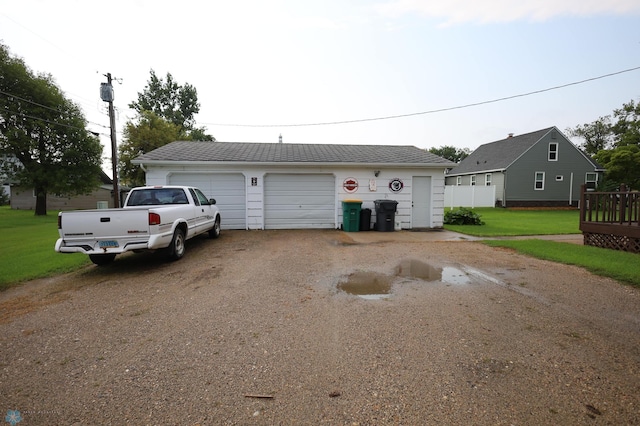 garage with a lawn