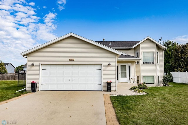 view of front of property with a garage and a front yard