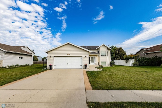 view of front of house featuring a garage and a front yard