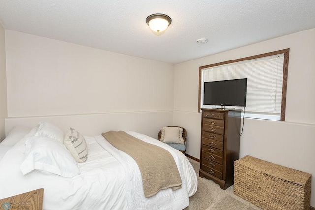 bedroom with light carpet