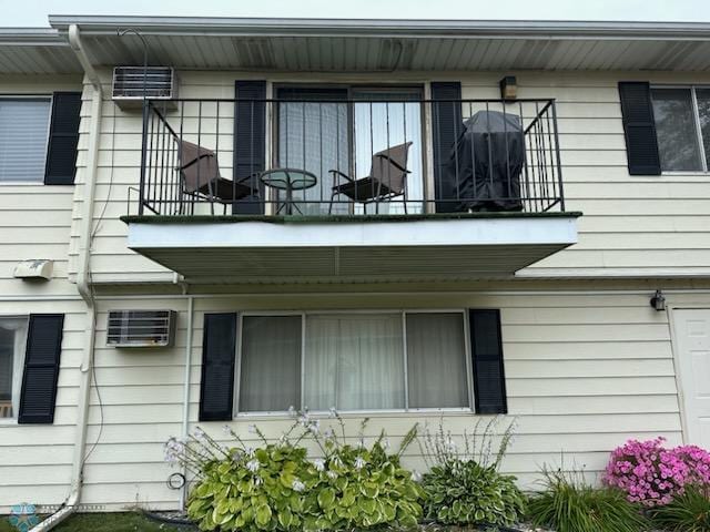 view of side of property featuring a balcony