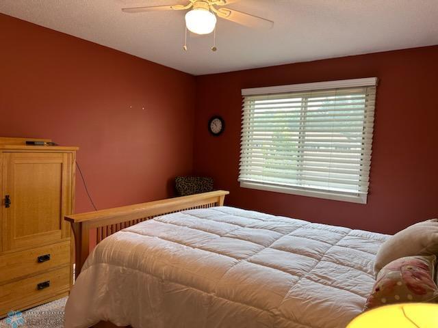 bedroom featuring carpet flooring and ceiling fan